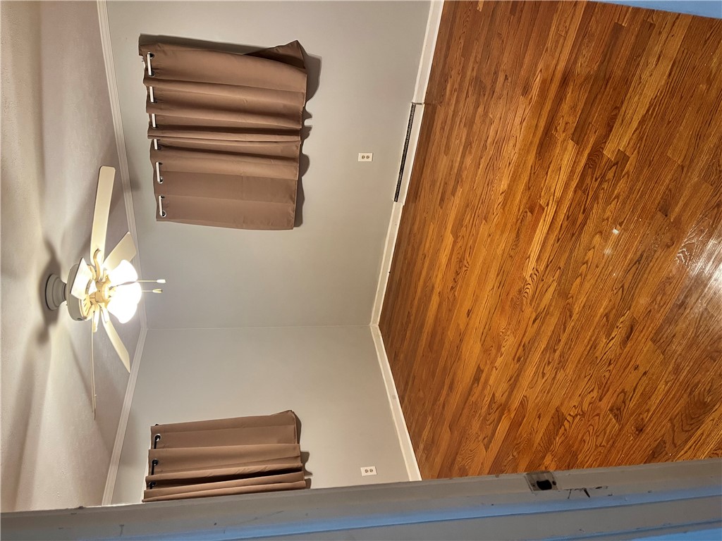 207 Pine Lane Anderson, SC 29621 - Photo 12 of 13 This inviting space features classic hardwood floors and an elegant ceiling fan.