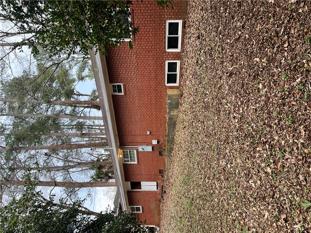 207 Pine Lane Anderson, SC 29621 - Photo 13 of 13 This brick residence offers a classic facade with ample yard space.