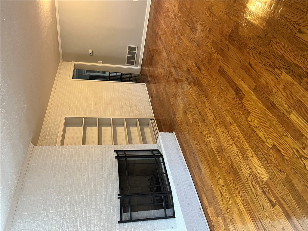 207 Pine Lane Anderson, SC 29621 - Photo 4 of 13 This inviting living area features warm wood flooring and a classic fireplace, perfect for cozy gatherings.