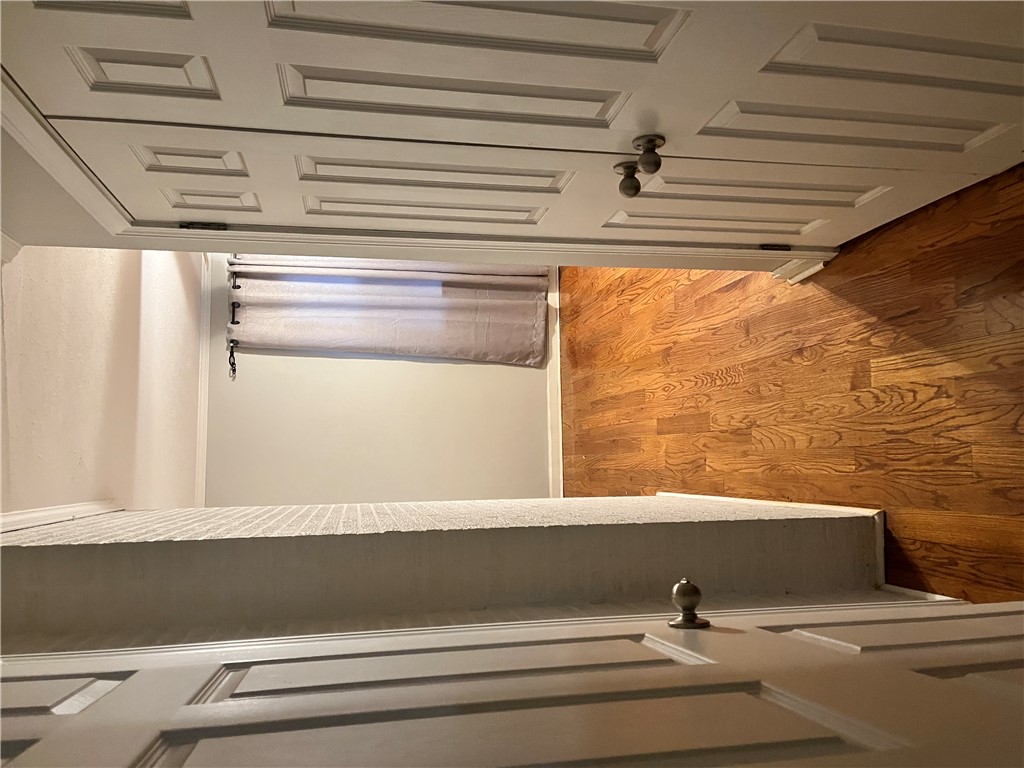 207 Pine Lane Anderson, SC 29621 - Photo 8 of 13 This living space features warm wood floors and ample natural light, ideal for comfortable living.