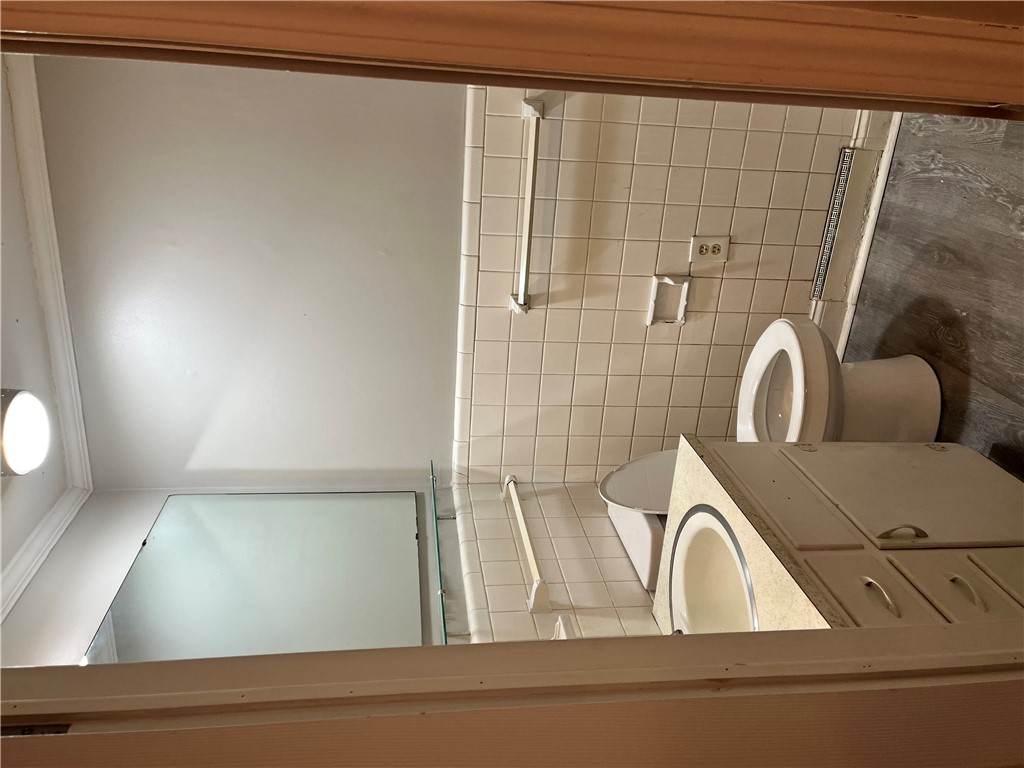 207 Pine Lane Anderson, SC 29621 - Photo 10 of 13 This functional bathroom features practical tiling and essential fixtures for daily routines.