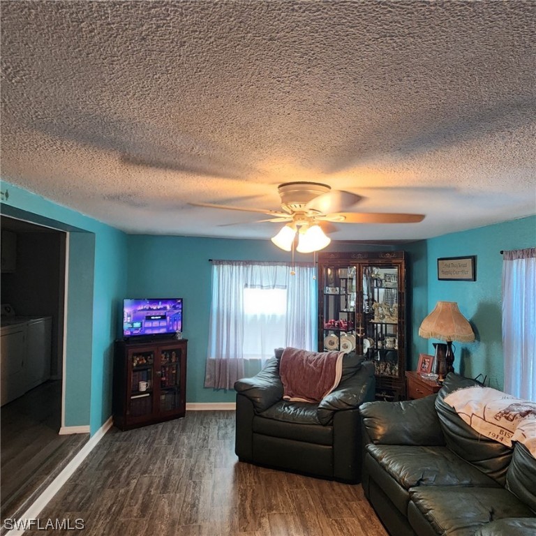 302 Pinecrest Avenue Moore Haven, FL 33471 - Photo 13 of 17 a living room with furniture a flat screen tv and a fireplace
