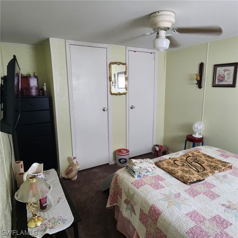 302 Pinecrest Avenue Moore Haven, FL 33471 - Photo 14 of 17 a bedroom with a bed and a window