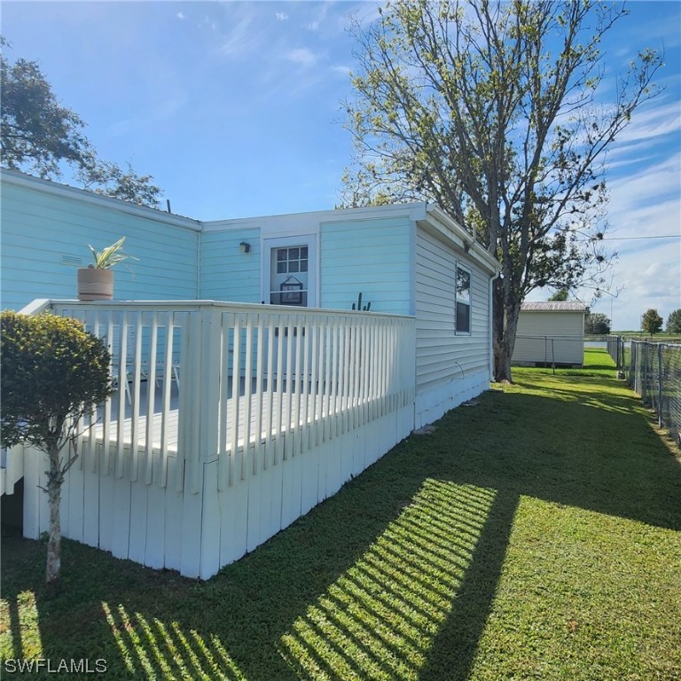 302 Pinecrest Avenue Moore Haven, FL 33471 - Photo 3 of 17 a view of a backyard with a garden
