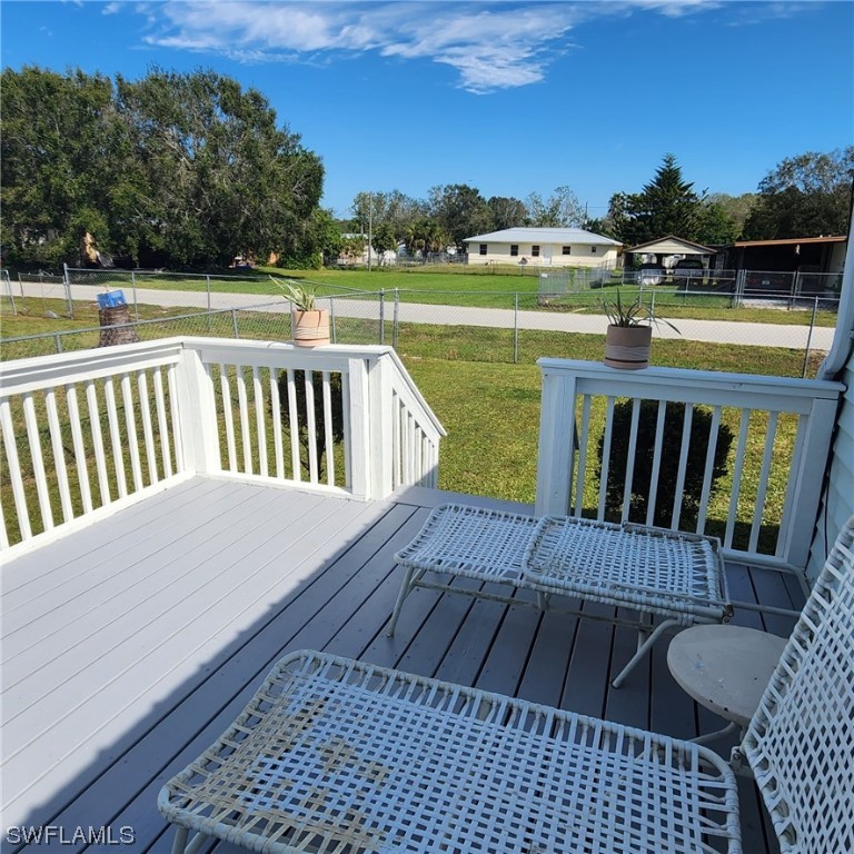 302 Pinecrest Avenue Moore Haven, FL 33471 - Photo 5 of 17 a view of a roof deck with couches