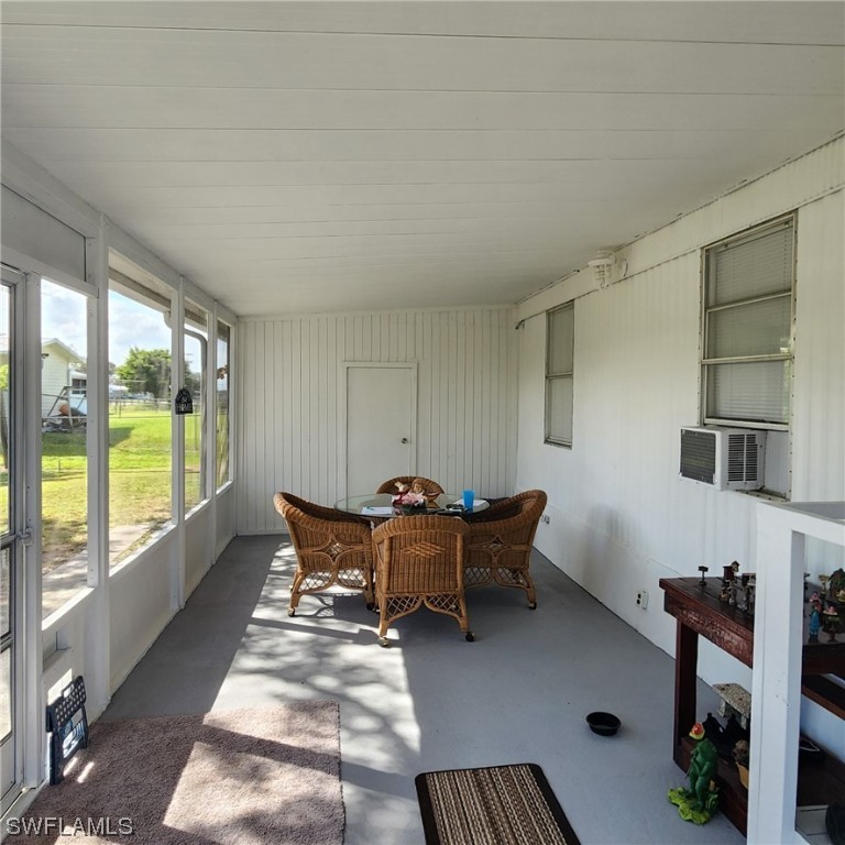302 Pinecrest Avenue Moore Haven, FL 33471 - Photo 9 of 17 a living room with furniture and a fireplace