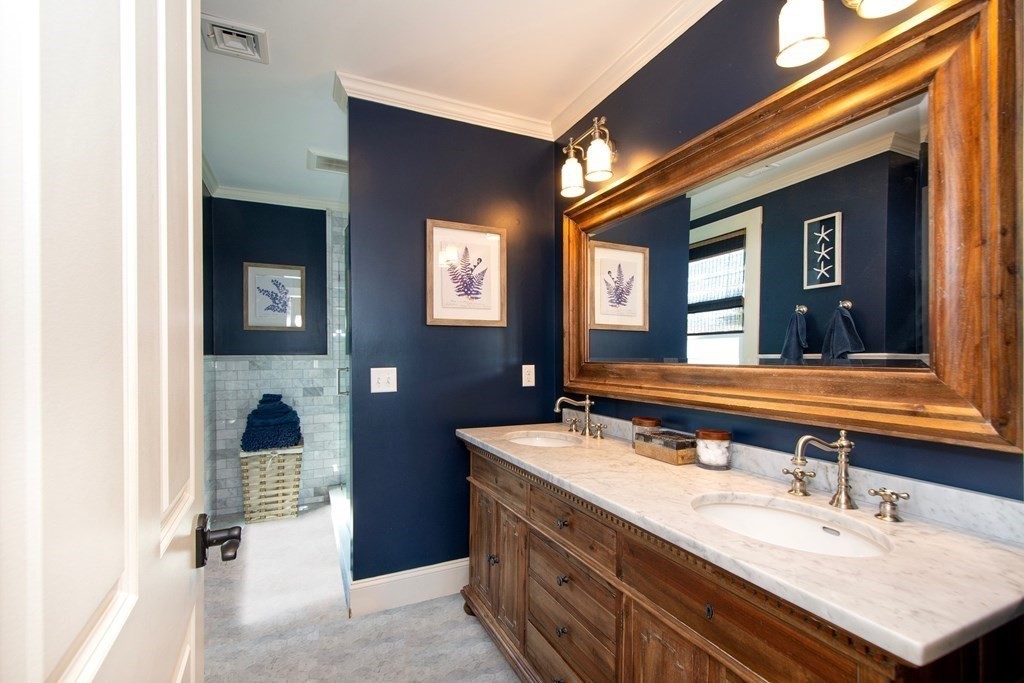 17 Gannett Road Scituate, MA 02066 - Photo 24 of 36 a bathroom with a sink and a mirror