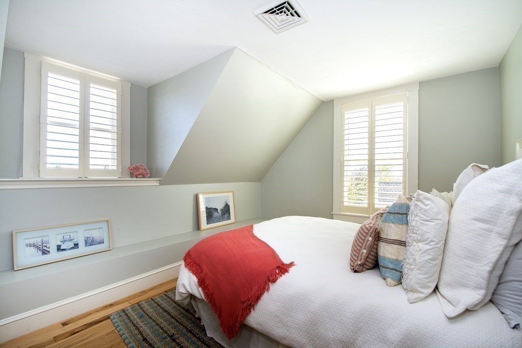 17 Gannett Road Scituate, MA 02066 - Photo 29 of 36 a bedroom with a bed and a window