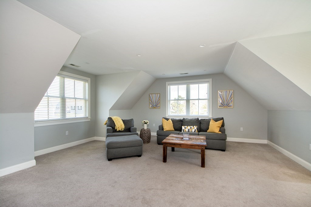 17 Gannett Road Scituate, MA 02066 - Photo 33 of 36 a living room with furniture and a window