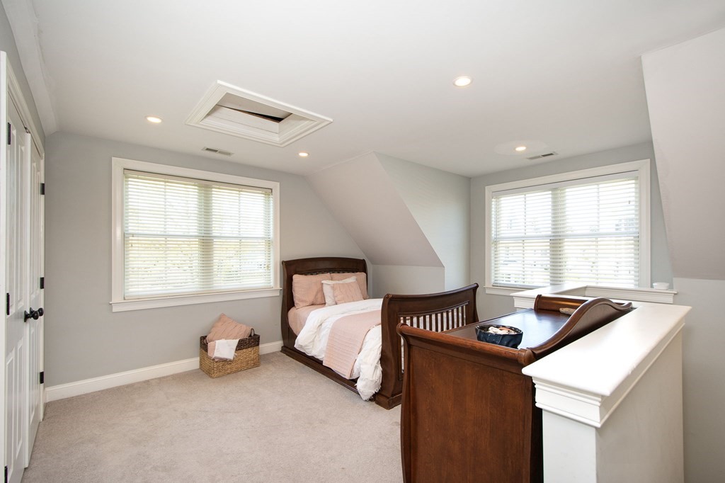 17 Gannett Road Scituate, MA 02066 - Photo 34 of 36 a bedroom with bed and a window
