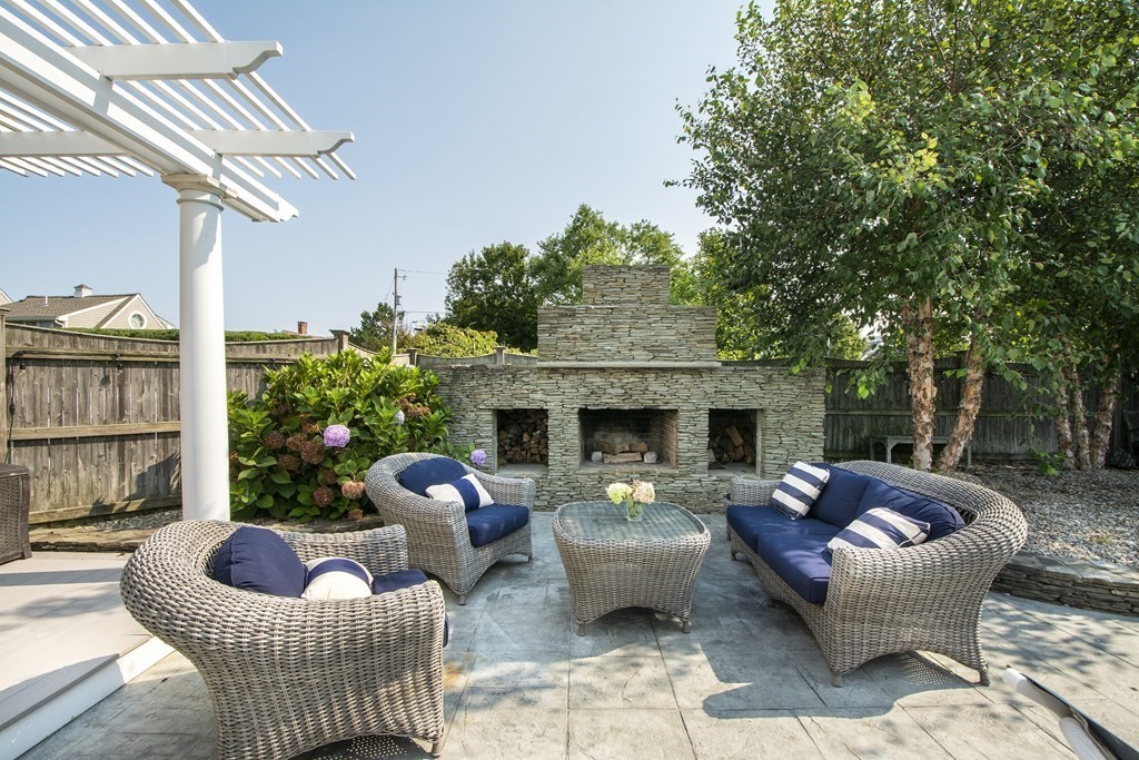 17 Gannett Road Scituate, MA 02066 - Photo 7 of 36 a outdoor space with patio fireplace couches and a fireplace