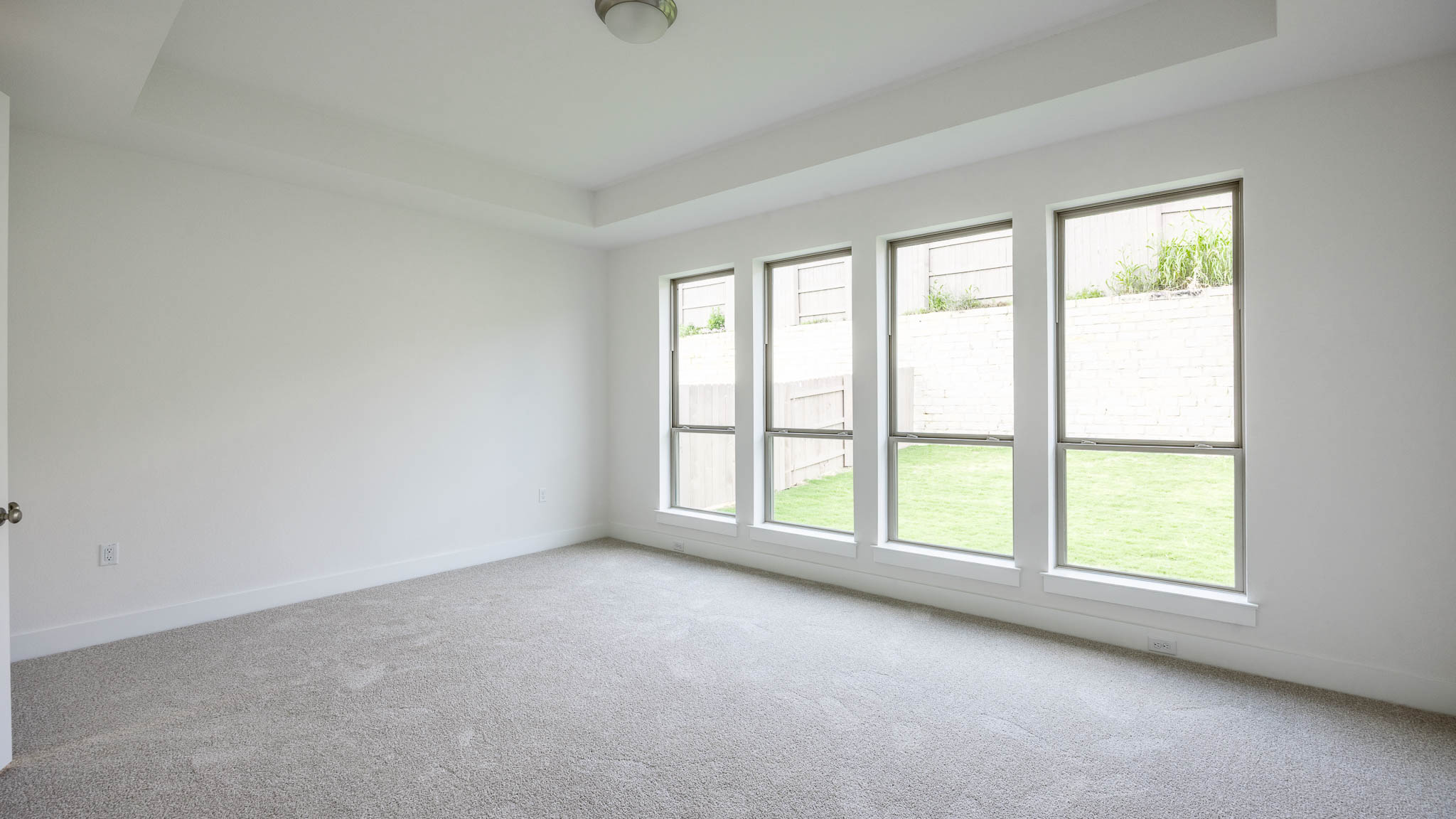 7002 Woodford Way Austin, TX 78744 - Photo 7 of 22 an empty room with windows