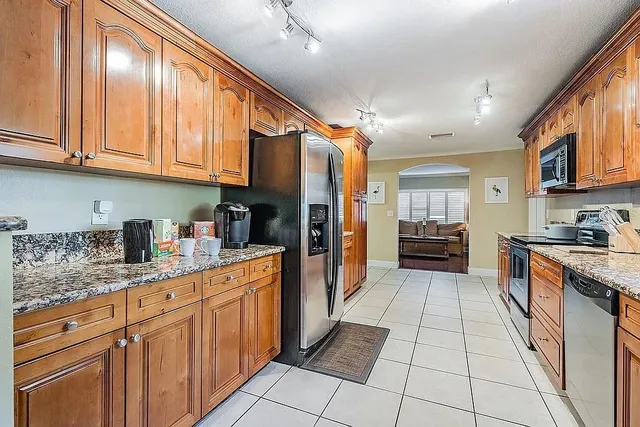a view of a livingroom with furniture and a flat screen tv