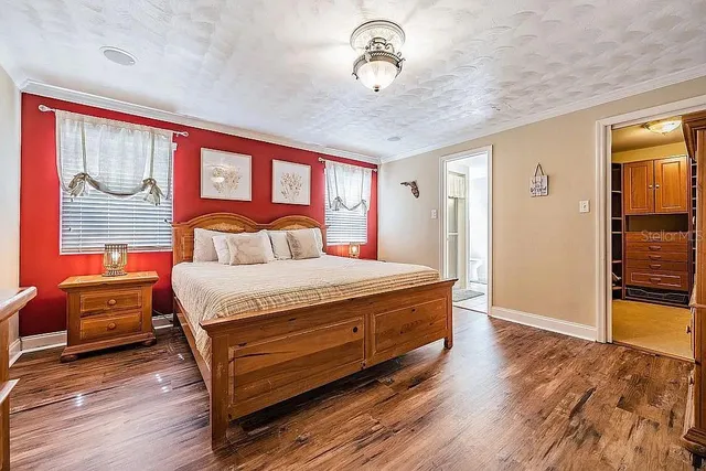 a view of a hallway to a livingroom and a couch
