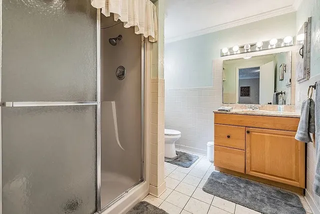 a view of a patio with a table and chairs under an umbrella