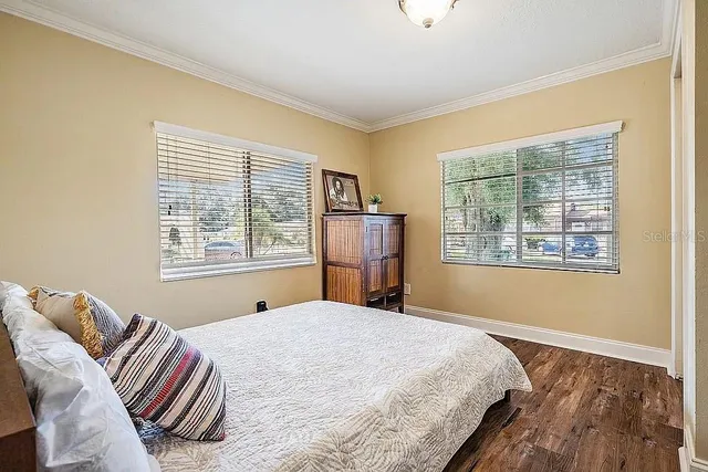 a patio with a table and chairs under an umbrella