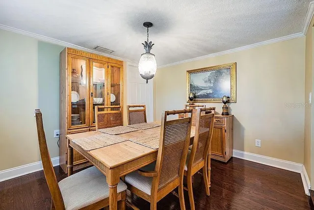 a kitchen with stainless steel appliances granite countertop a refrigerator and stove