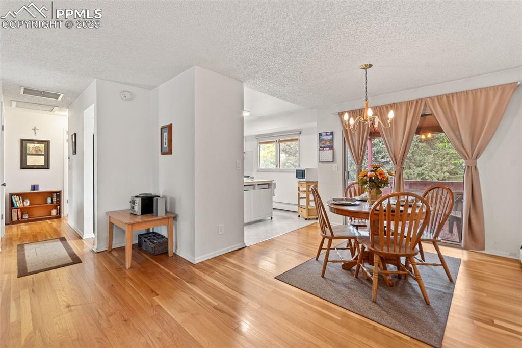 2801 South Reed Street Denver, CO 80227 - Photo 11 of 44 a view of a dining room with furniture window and outside view