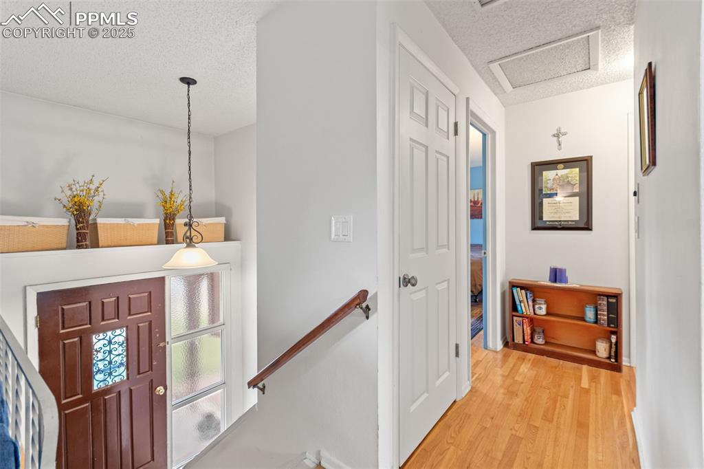 2801 South Reed Street Denver, CO 80227 - Photo 20 of 44 a view of a hallway with wooden floor and staircase