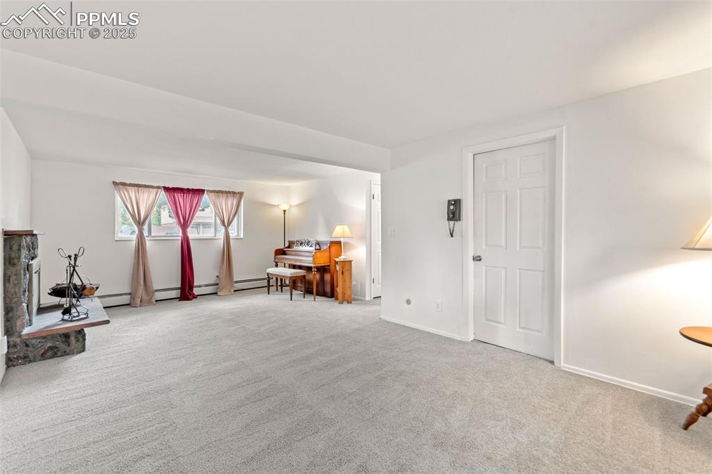 2801 South Reed Street Denver, CO 80227 - Photo 29 of 44 a view of a room with gym equipment and a large window