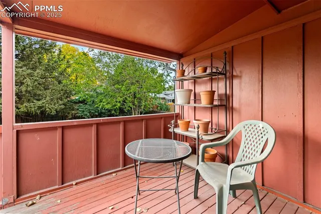 a view of a balcony with chairs