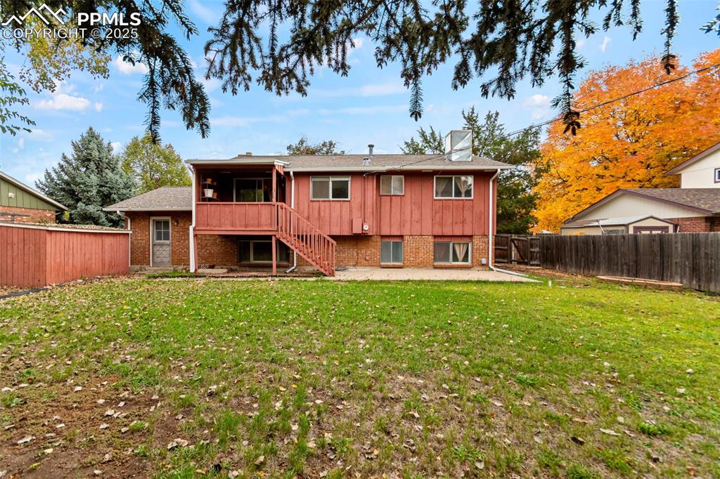 2801 South Reed Street Denver, CO 80227 - Photo 38 of 44 a view of a house with a backyard