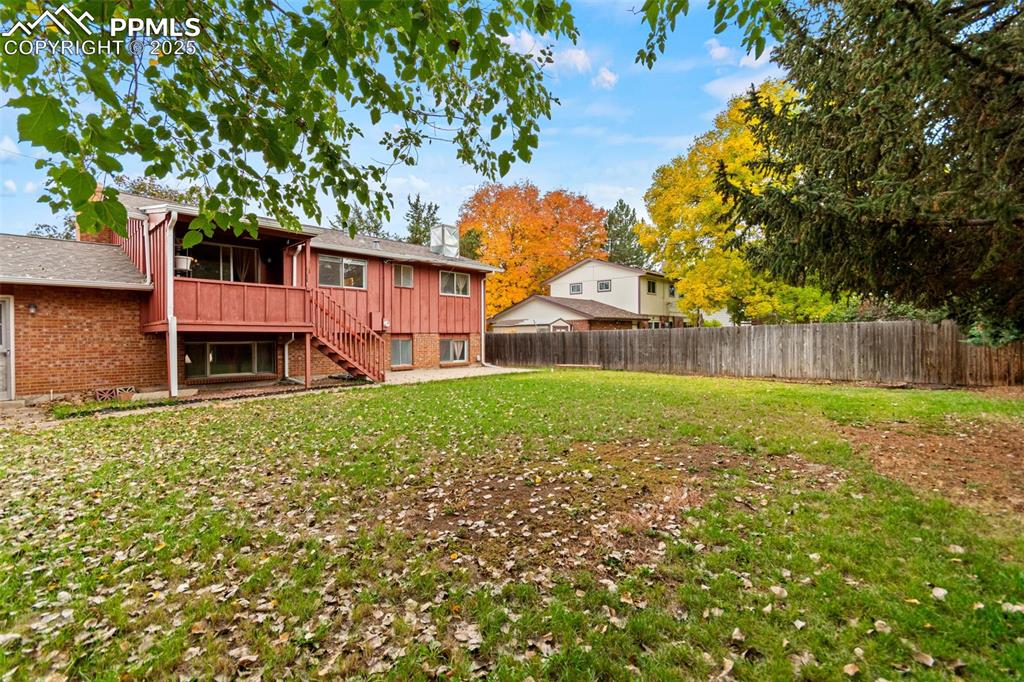 2801 South Reed Street Denver, CO 80227 - Photo 39 of 44 a view of a house with a yard