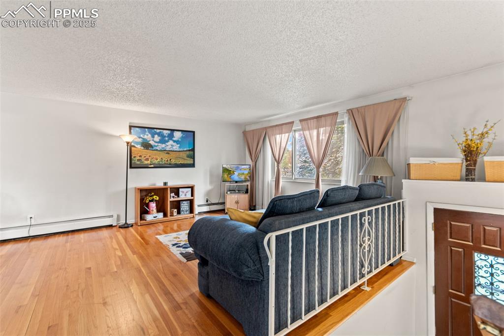 2801 South Reed Street Denver, CO 80227 - Photo 7 of 44 a living room with furniture and a floor to ceiling window