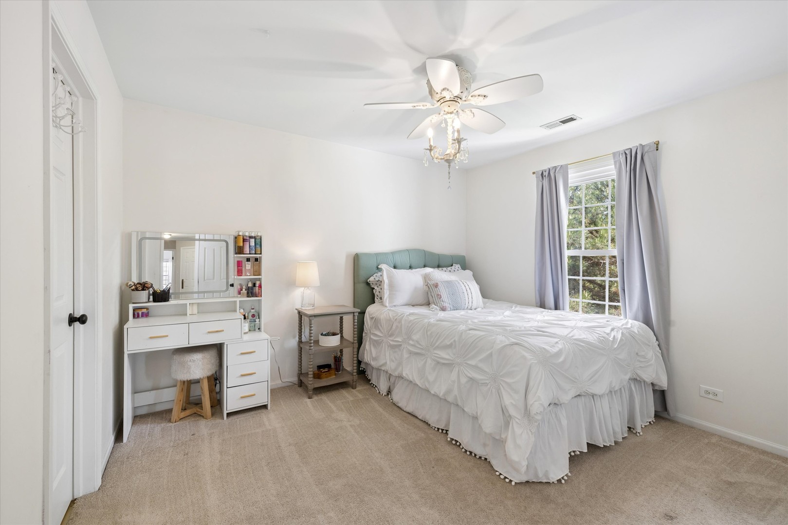 340 Tenby Way Algonquin, IL 60102 - Photo 17 of 36 a bedroom with bed and a chandelier