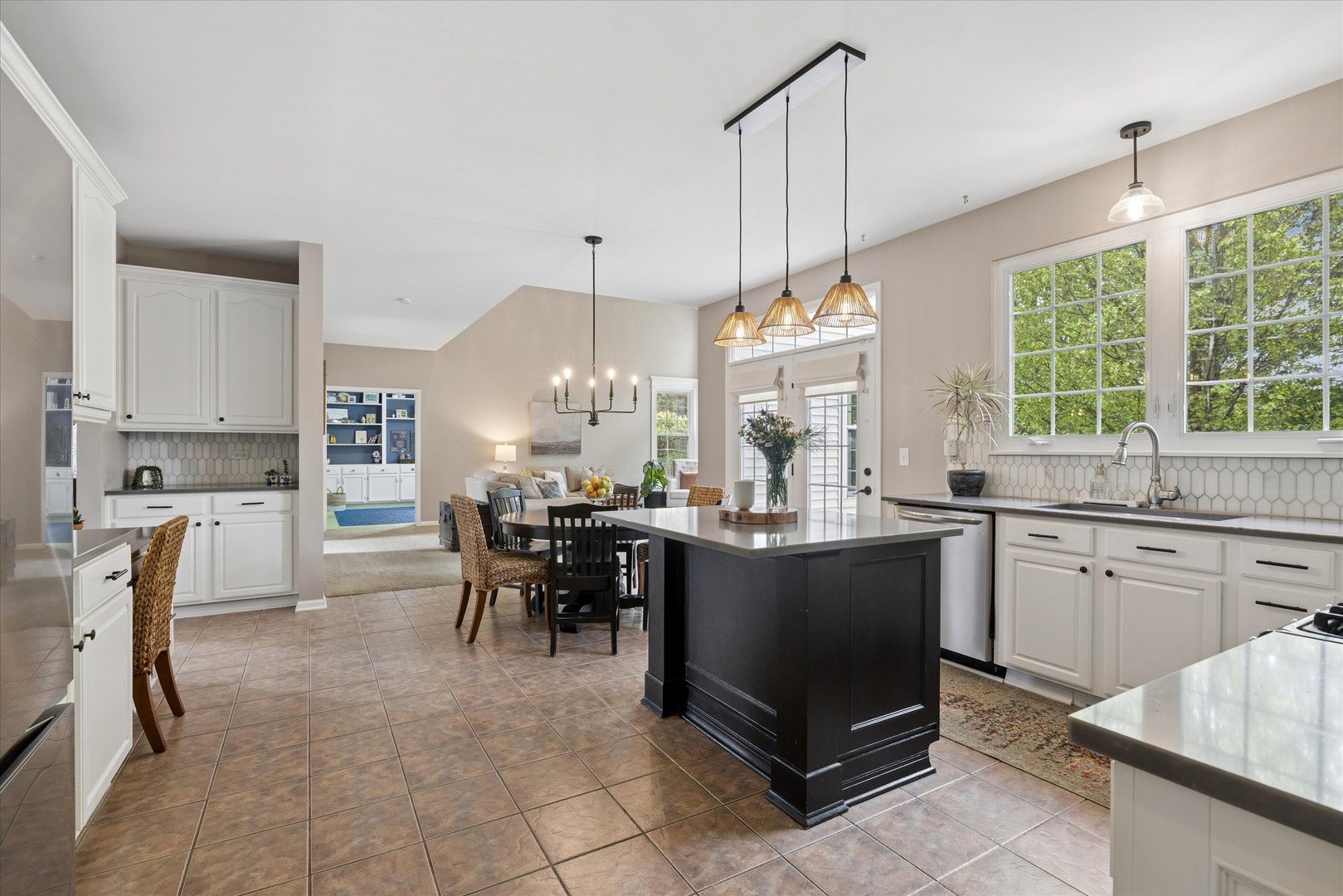 340 Tenby Way Algonquin, IL 60102 - Photo 9 of 36 a open kitchen with granite countertop a table and chairs in it