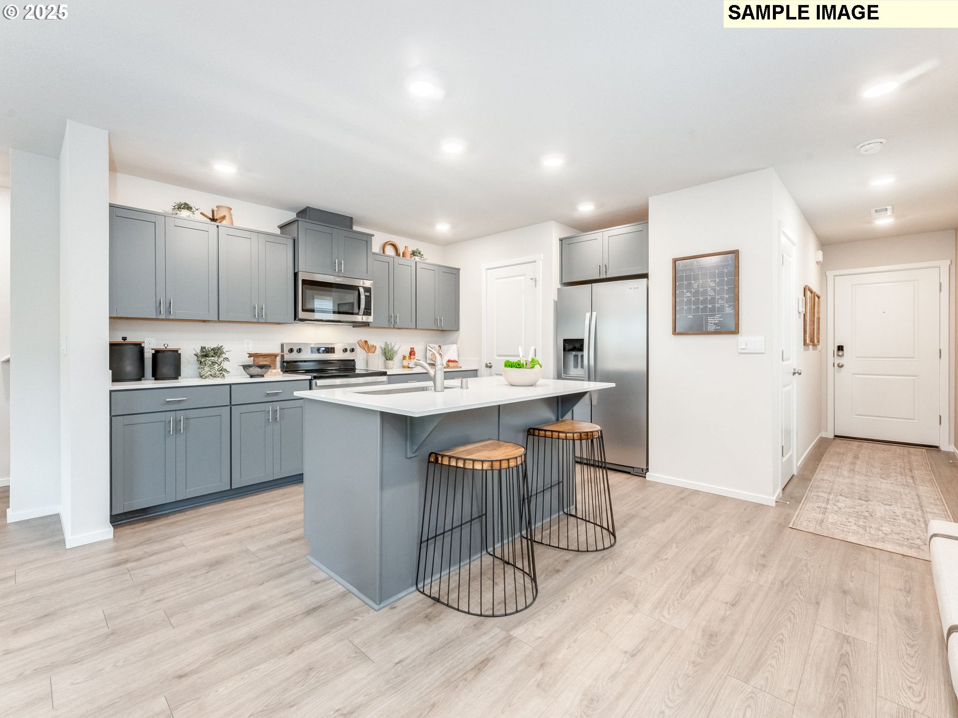 1113 Southeast 194th Place Camas, WA 98607 - Photo 3 of 27 a kitchen with a sink cabinets stainless steel appliances and wooden floor
