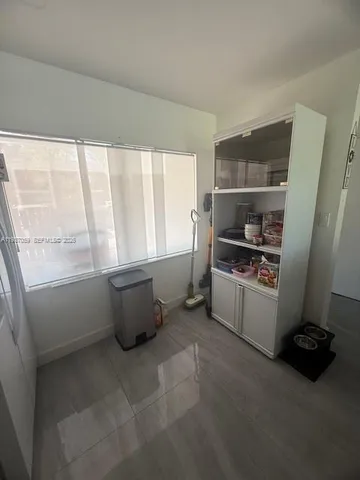 a room with a window and storage