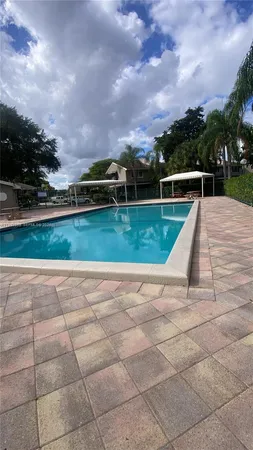 a view of a garden with wooden fence