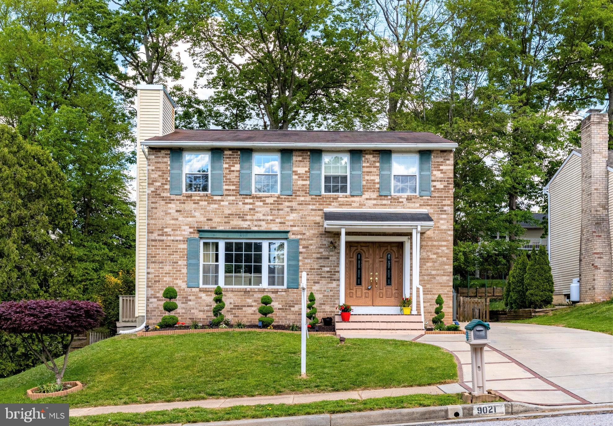 9021 Moonstone Road Nottingham, MD 21236 - Photo 1 of 36 a front view of a house with a garden and yard