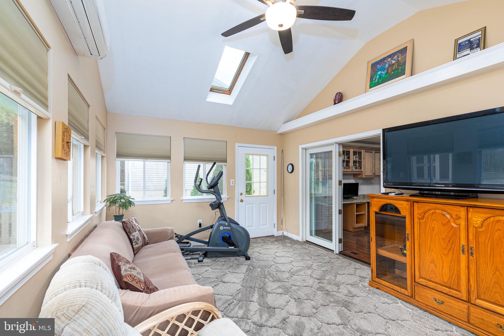 9021 Moonstone Road Nottingham, MD 21236 - Photo 14 of 36 a living room with furniture a ceiling fan and a window