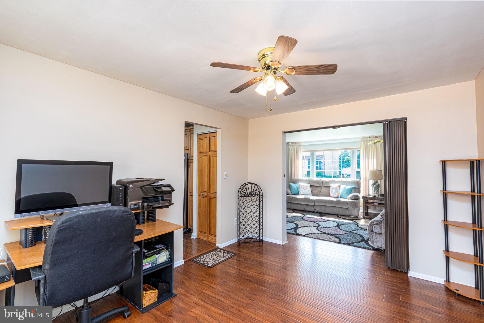 9021 Moonstone Road Nottingham, MD 21236 - Photo 7 of 36 a view of a livingroom with workspace and a window