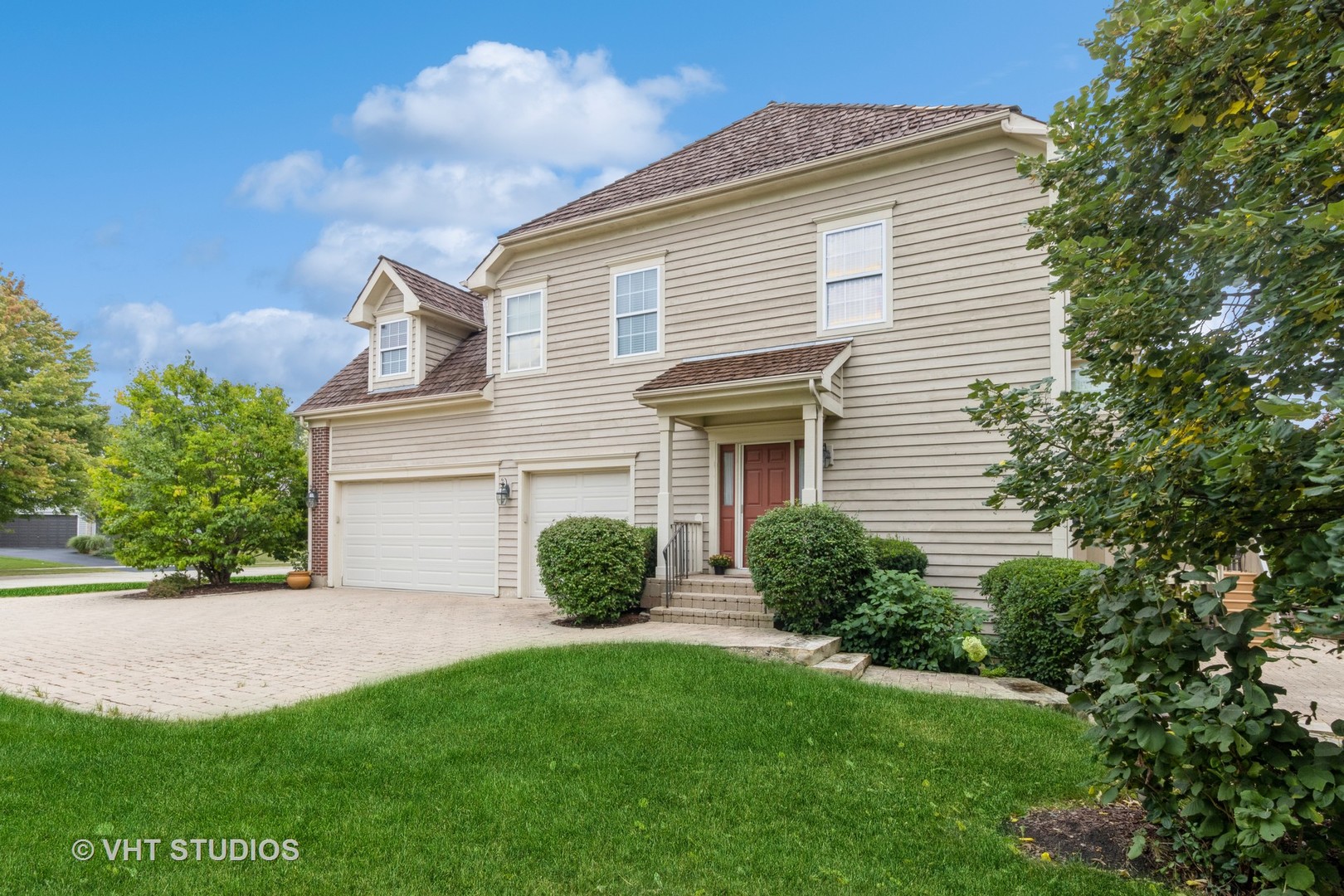 210 Bridle Path Lane Fox River Grove, IL 60021 - Photo 2 of 17 a front view of a house with a yard and garage