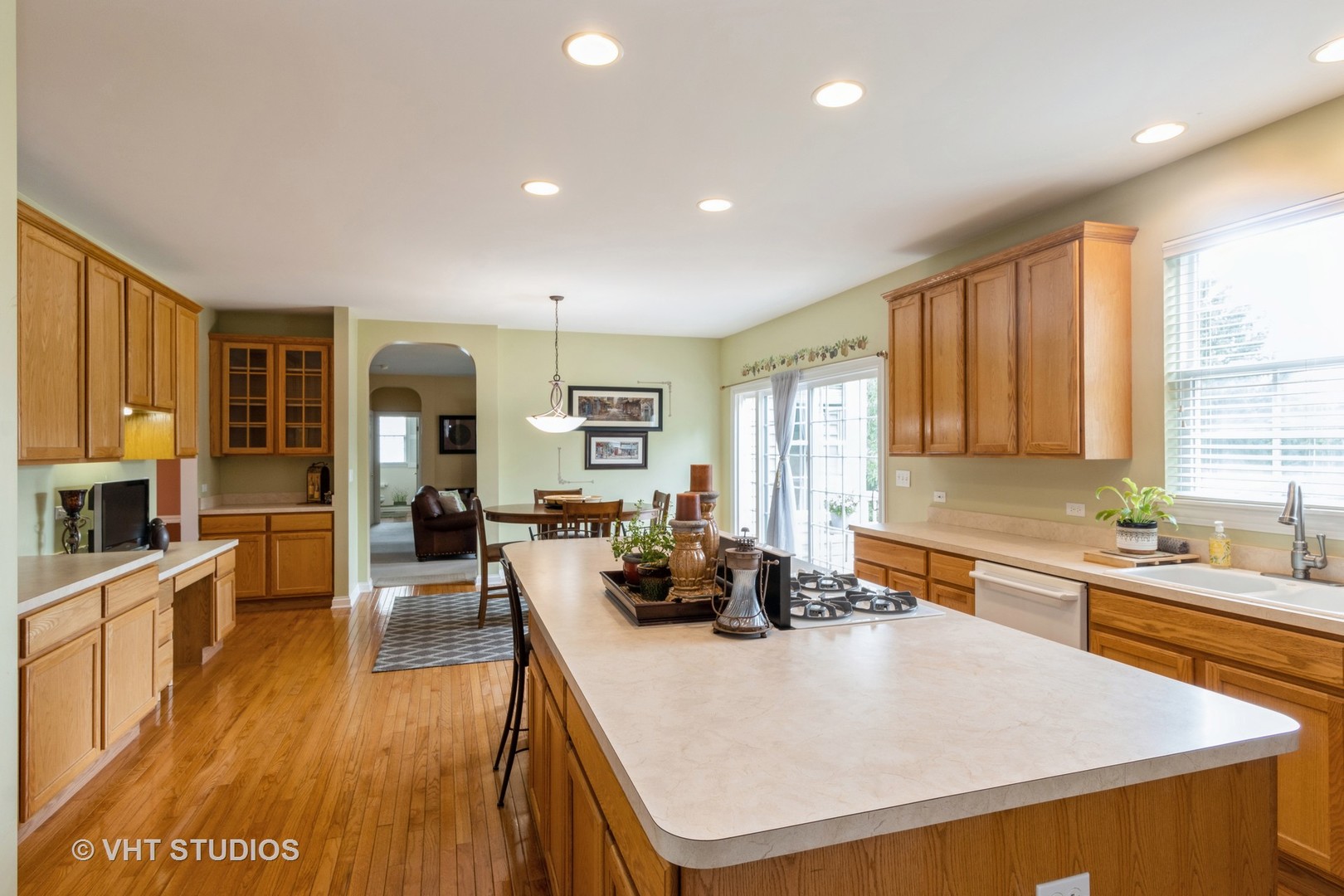 210 Bridle Path Lane Fox River Grove, IL 60021 - Photo 8 of 17 a kitchen with stainless steel appliances granite countertop a sink a stove and a refrigerator