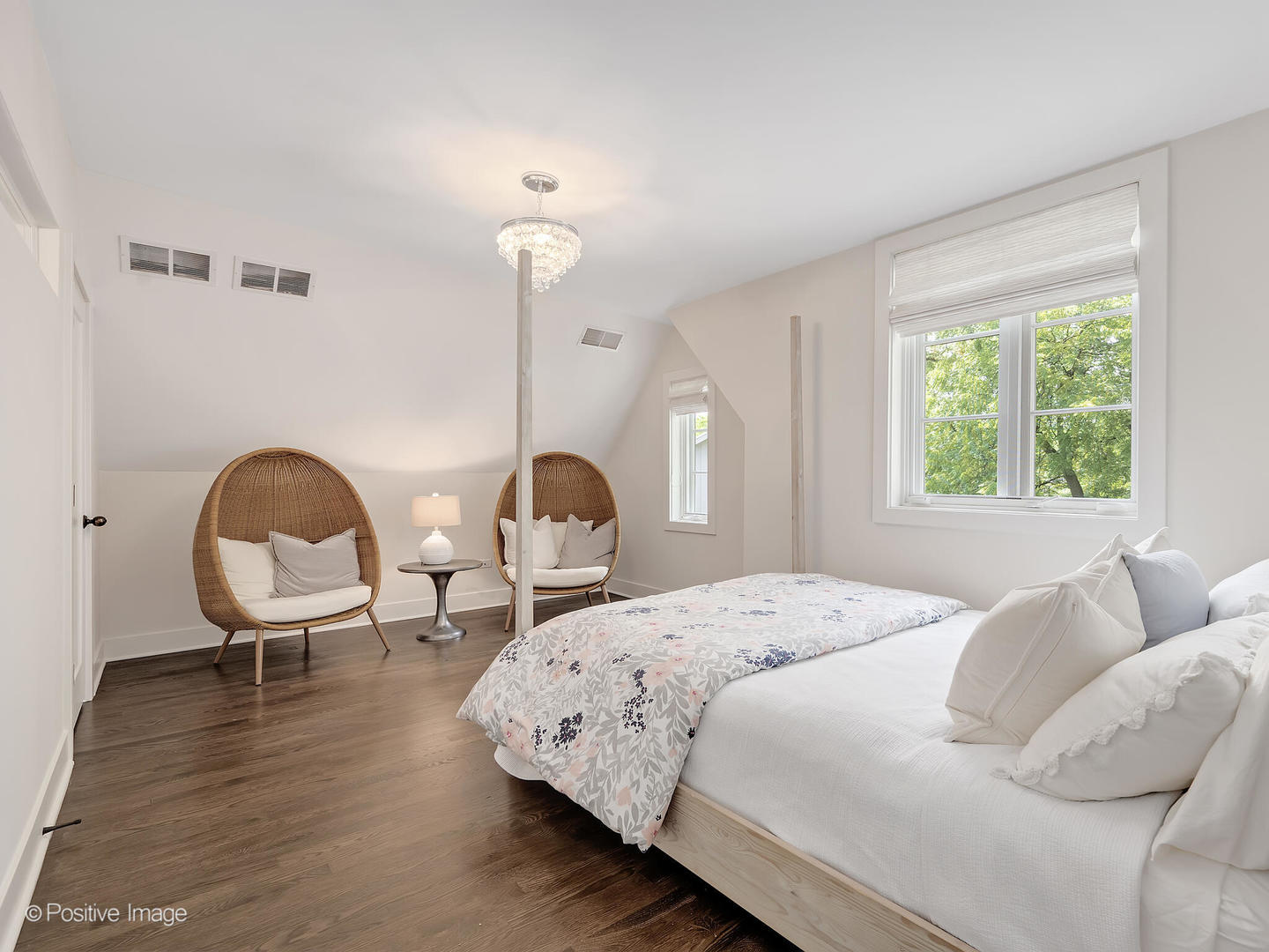 300 Forest Road Hinsdale, IL 60521 - Photo 28 of 43 a bedroom with a bed a lamp and wooden floor