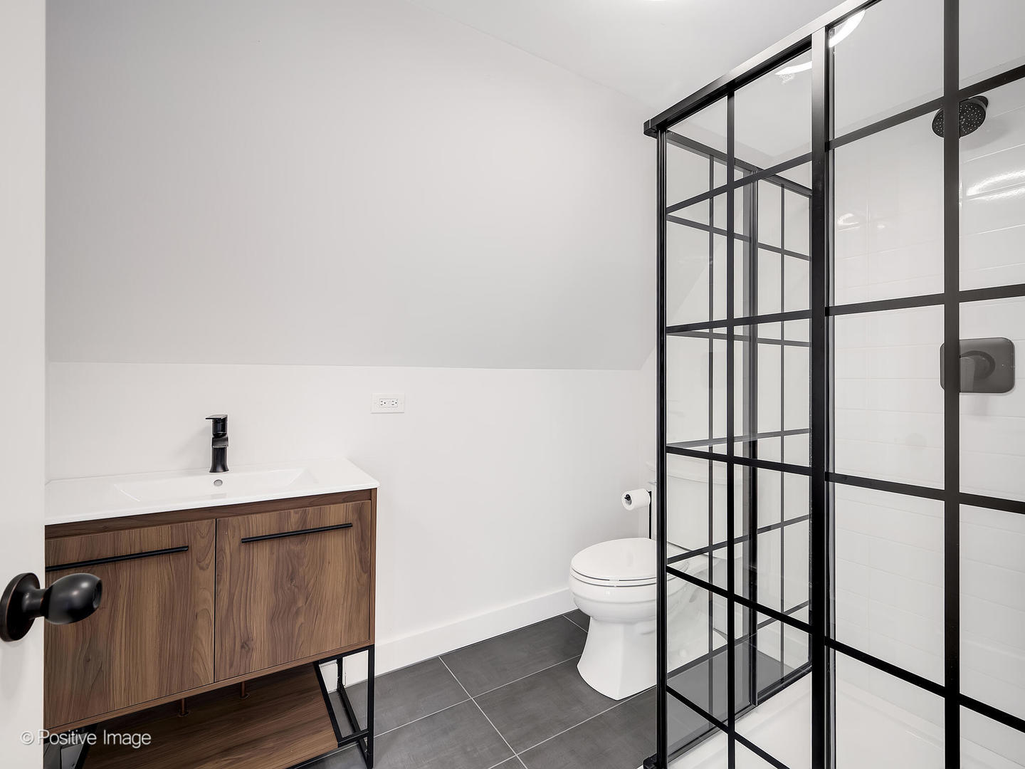 300 Forest Road Hinsdale, IL 60521 - Photo 35 of 43 a bathroom with a toilet a sink and mirror