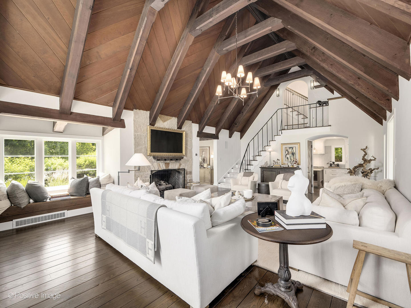 300 Forest Road Hinsdale, IL 60521 - Photo 9 of 43 a living room with furniture a fireplace and a table