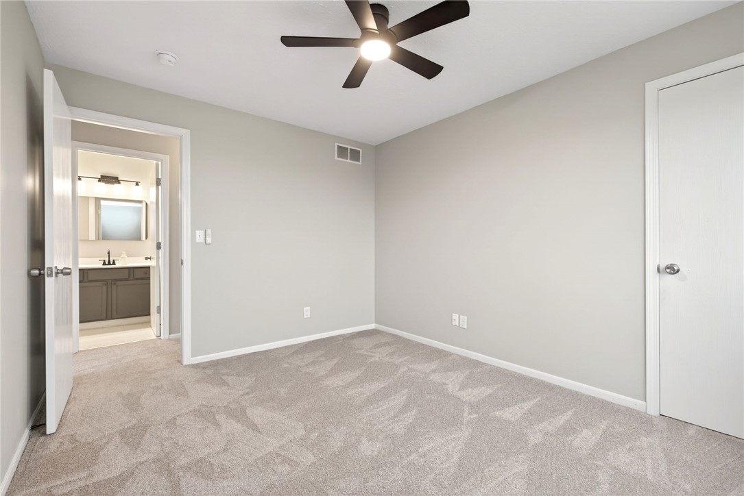 3151 Roesch Boulevard, Unit 6 Fairfield, OH 45014 - Photo 17 of 29 This cozy bedroom features plush carpeting and a modern ceiling fan, creating a comfortable living space.