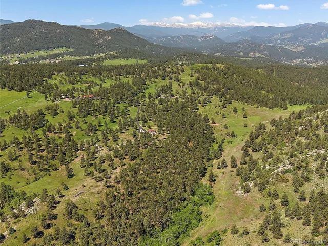 a view of a house with backyard porch and sitting area