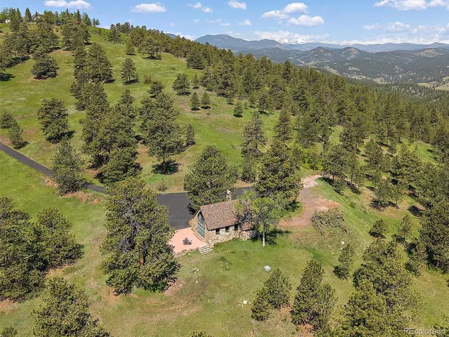 a kitchen with stainless steel appliances granite countertop a sink and a refrigerator