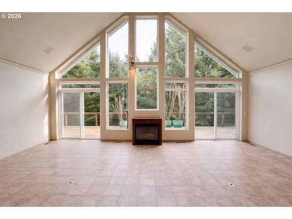 a view of an empty room with a fireplace