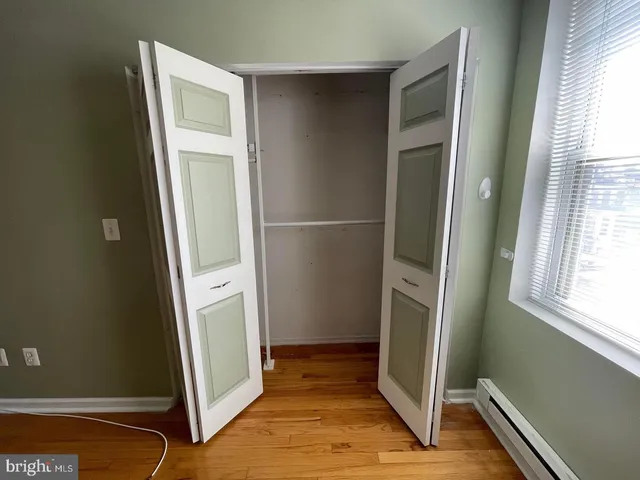 a view of front door with wooden floor
