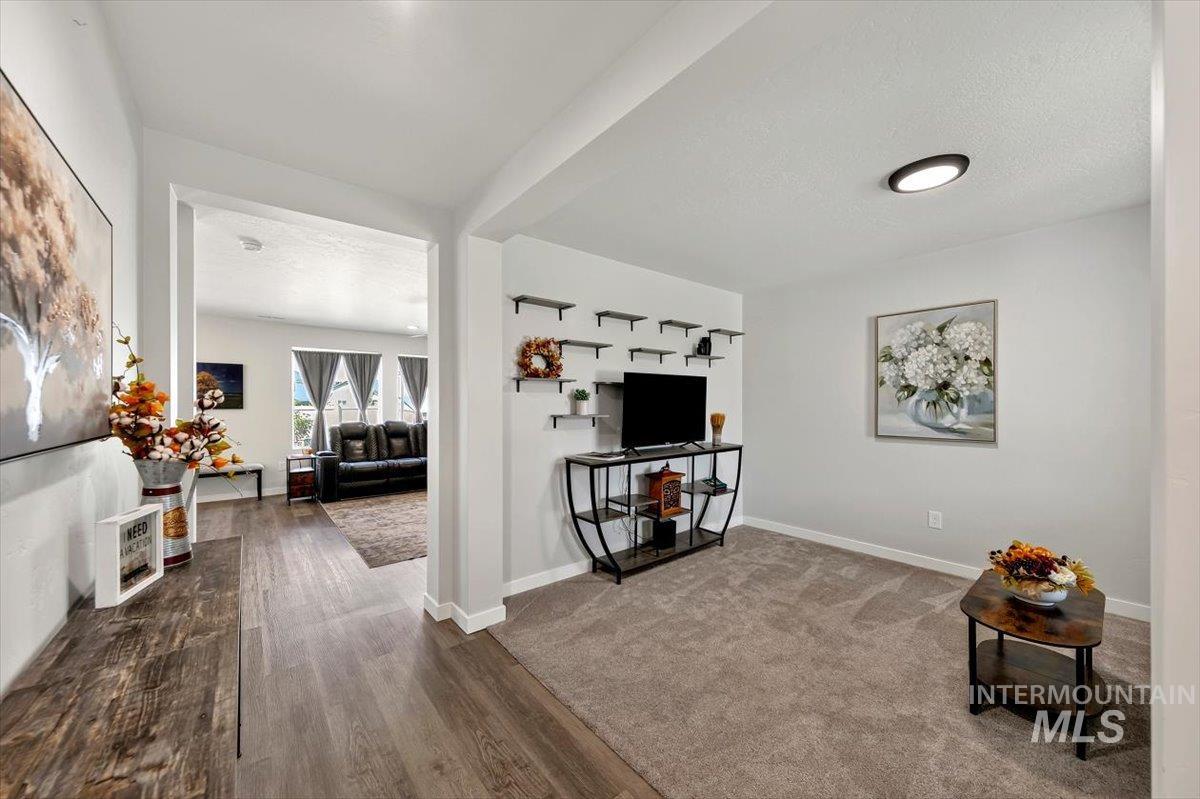 8575 South Foraker Way Kuna, ID 83634 - Photo 3 of 43 Formal family room featuring neutral carpet