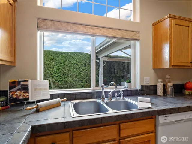 a kitchen with a sink and a window