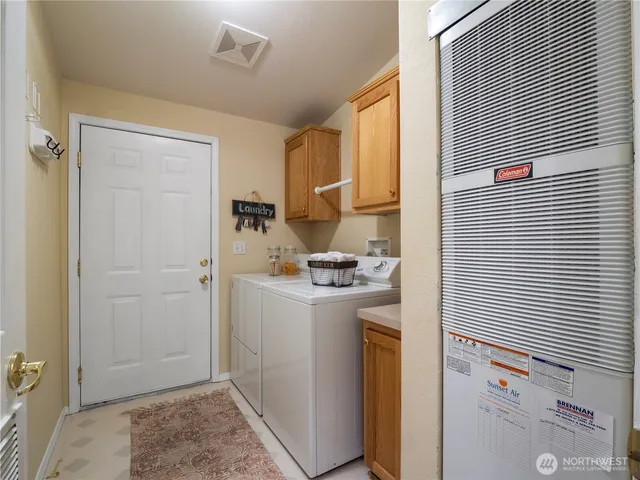 a view of a room with chairs and a table