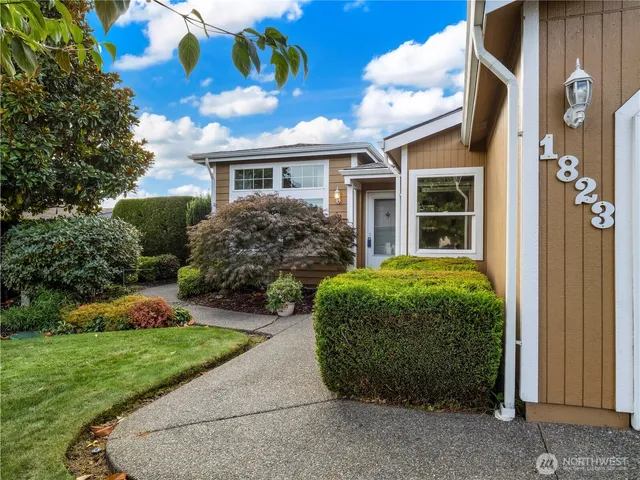 a front view of a house with garden